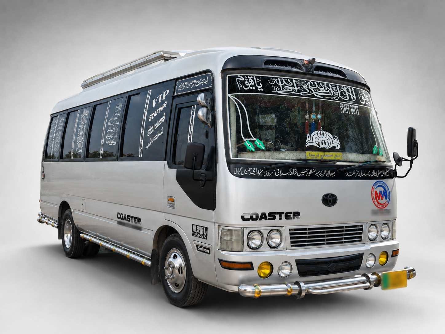 White Toyota Coaster for staff pick and drop